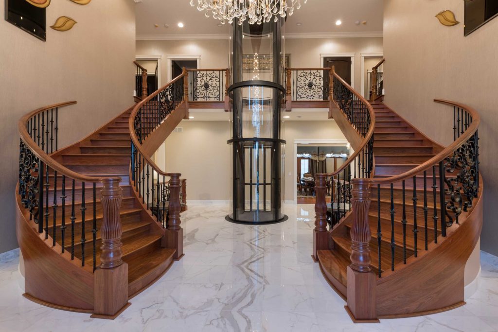 round glass elevator in mansion