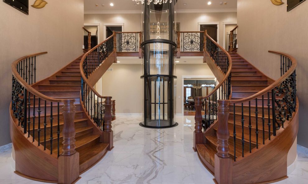 round glass elevator in mansion