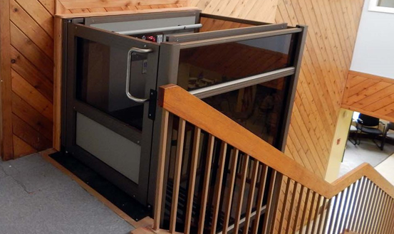 Vertical wheelchair lifts for schools