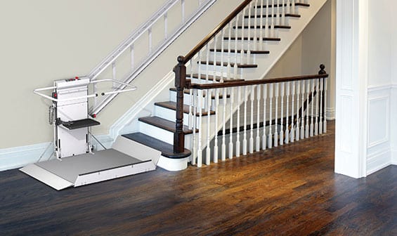 Inclined wheelchair lift on home stairwell