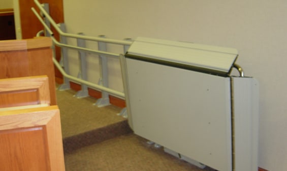 Indoor wheelchair lift in public building by Garaventa