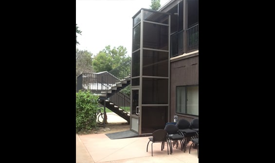 Exterior vertical wheelchair lift