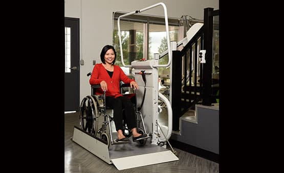 woman using wheelchair lift