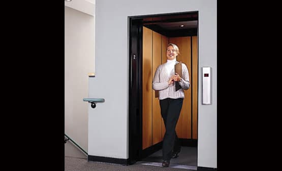 Woman using a Savaria Limited Use Limited Application Elevator