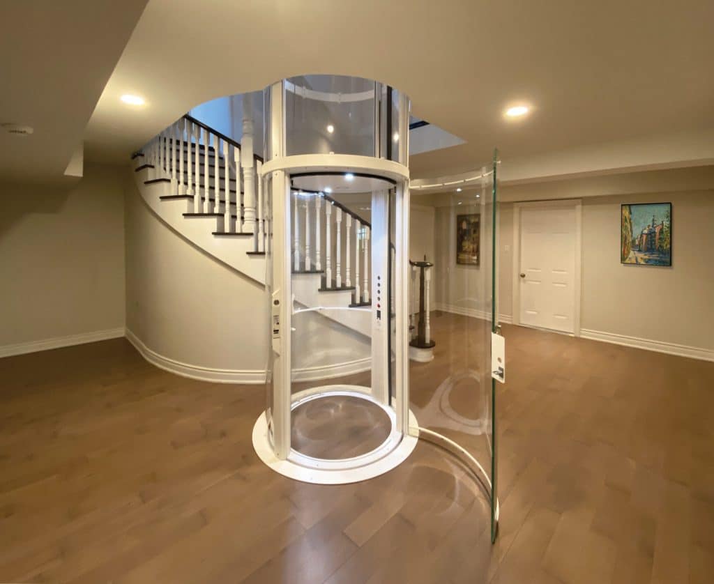 Round glass elevator in luxury home