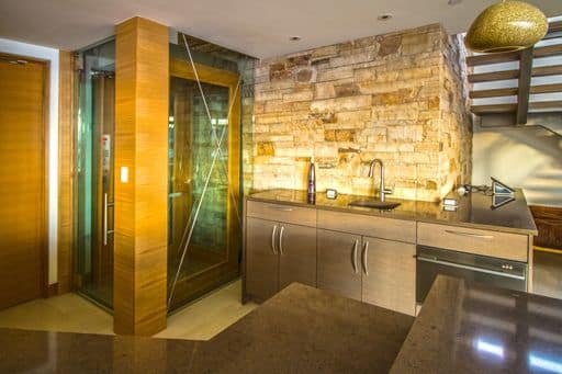 Glass elevator with wood trim